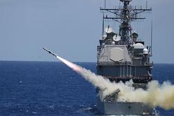 A Harpoon missile launches from the Guided Missile Cruiser USS Lake Erie (CG 70) during 2008 RIMPAC exercises.